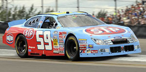 Marcos Ambrose wins NASCAR Nationwide Series race at Watkins Glen using Bassett 15 x 9.5 SFI 35.1 Wheels on Aug. 9, 2008.